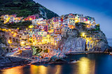 Scenic night view of colorful village Manarola in Cinque Terre