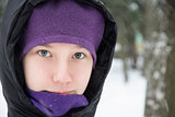 young teenage girl in black down jacket