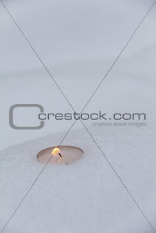 simple candle on the snow