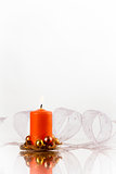 orange candle and white ribbon