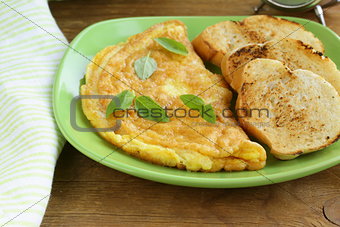 fresh egg omelet with basil for breakfast