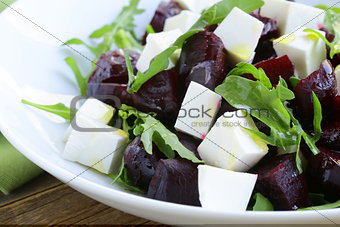 salad with beetroot and soft feta cheese and arugula
