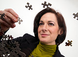 Business Woman Working a Jigsaw Puzzle