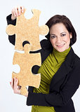 Woman Working With Two Large Jigsaw Puzzle Pieces