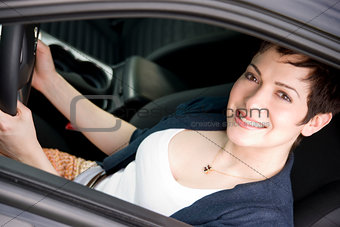 Driver Attractive Female Drives New Fast Car