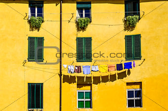 Detail of colorful yellow house walls and windows