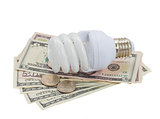 energy saving lamp bulb on dollars
