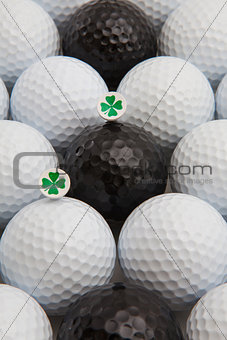 White and black golf balls and wooden tees