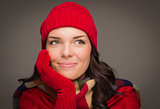 Mixed Race Woman Wearing Mittens Looks to Side