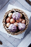 Onions and garlic bulbs in a basket