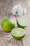 Limes on wood background