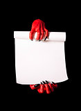 Red devil hands with black nails holding blank paper scroll