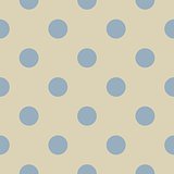 Retro seamless pattern or texture with big pastel blue polka dots on light beige, neutral background