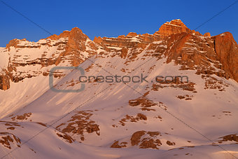 Sunrise in snowy mountains