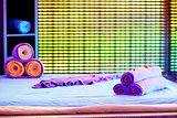 Towels on the bed in a spa decorative decorated.