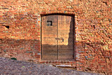 Brick wall with wooden door.