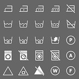 Laundry icons on gray background