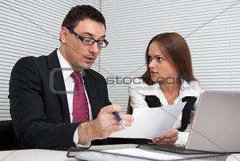two Business people Having Meeting In Office