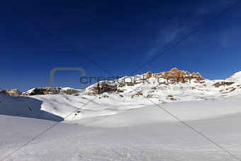 Snow plateau and blue sky in sunny spring day