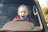 Crying scared girl in the car