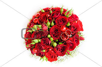 Wedding rings on a bouquet of roses