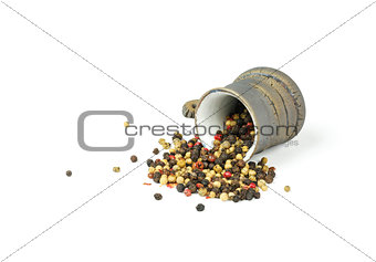 Pepper seeds in a cup on a white background
