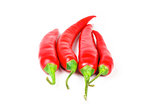 Fresh juicy red peppers on a white background