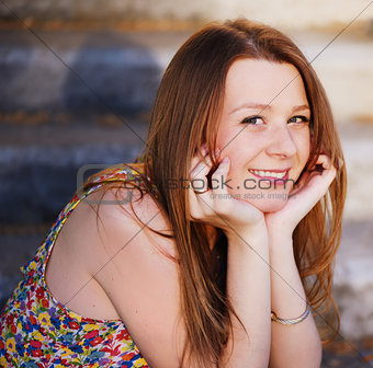 Smiling red-haired girl.
