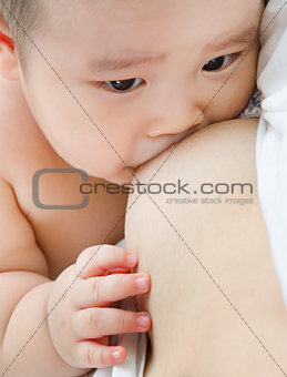 Mother breast feeding baby