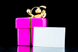 Pink wrapped gift with blank card
