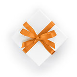 white textured gift box with orange ribbon bow