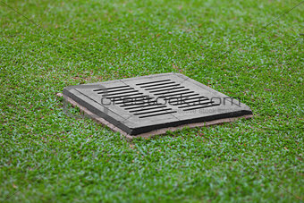 Sewer grate on the lawn - drainage for heavy rain