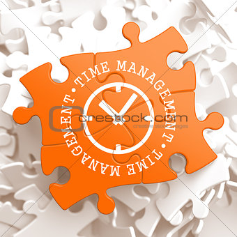Time Management Concept on Orange Puzzle Pieces.