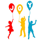 Children holding balloons with Joy message 