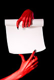 Red devil hands with paper scroll 