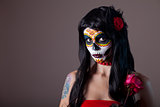 Halloween sugar skull girl with red rose 