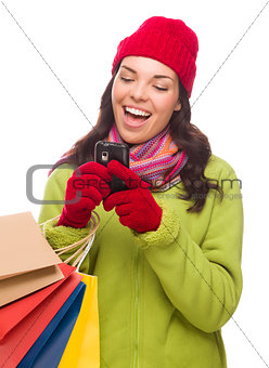 Mixed Race Woman Holding Shopping Bags Texting On Cell Phone 