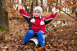 Boy in autumn forest