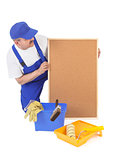 House painter and empty corkboard 