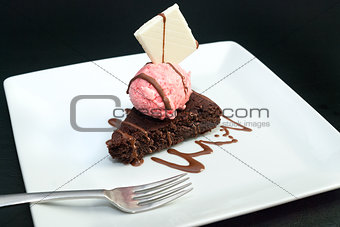 Brownie With Raspberry Icecream, Fork On Plate