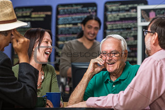 Group in Cafe Laughing