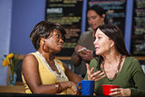 Diverse Friends Talking in Cafe