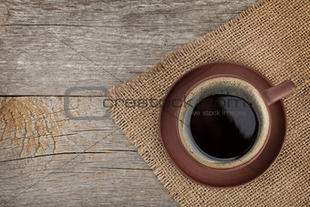 Coffee cup on wooden table texture