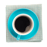 Blue coffee cup over kitchen towel