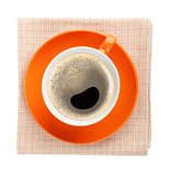 Orange coffee cup over kitchen towel
