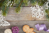 Christmas fir tree and decor on wooden board background
