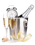 Christmas champagne with alarm clock in bucket