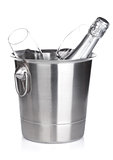 Champagne bottle in bucket and empty glasses