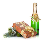 Champagne bottle, christmas gift box, decor and fir tree