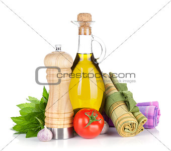 Fresh herbs, tomato, olive oil and pepper shaker